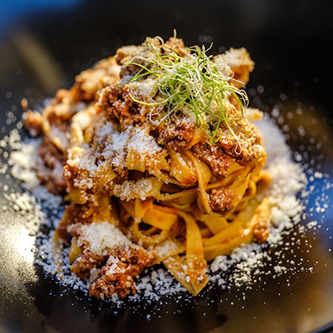 Photo of noodles and bolognese sauce