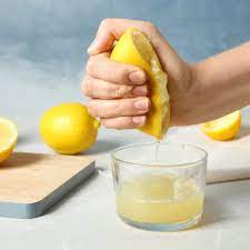Photo of Lemon Juicer, Lemons, and Lemon Juice