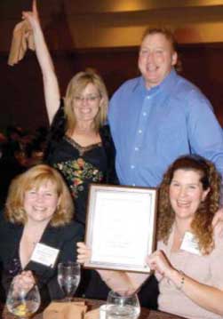 Photograph of Jill Harmacinski getting an award