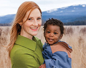 A photograph of Fern Johnson holding a child