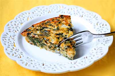 crustless spinach quiche on a white plate