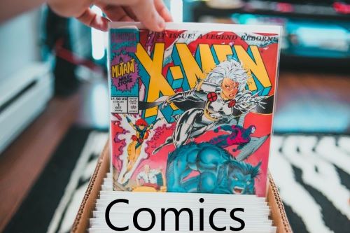 person's hand picking out an X-Men comic from full box