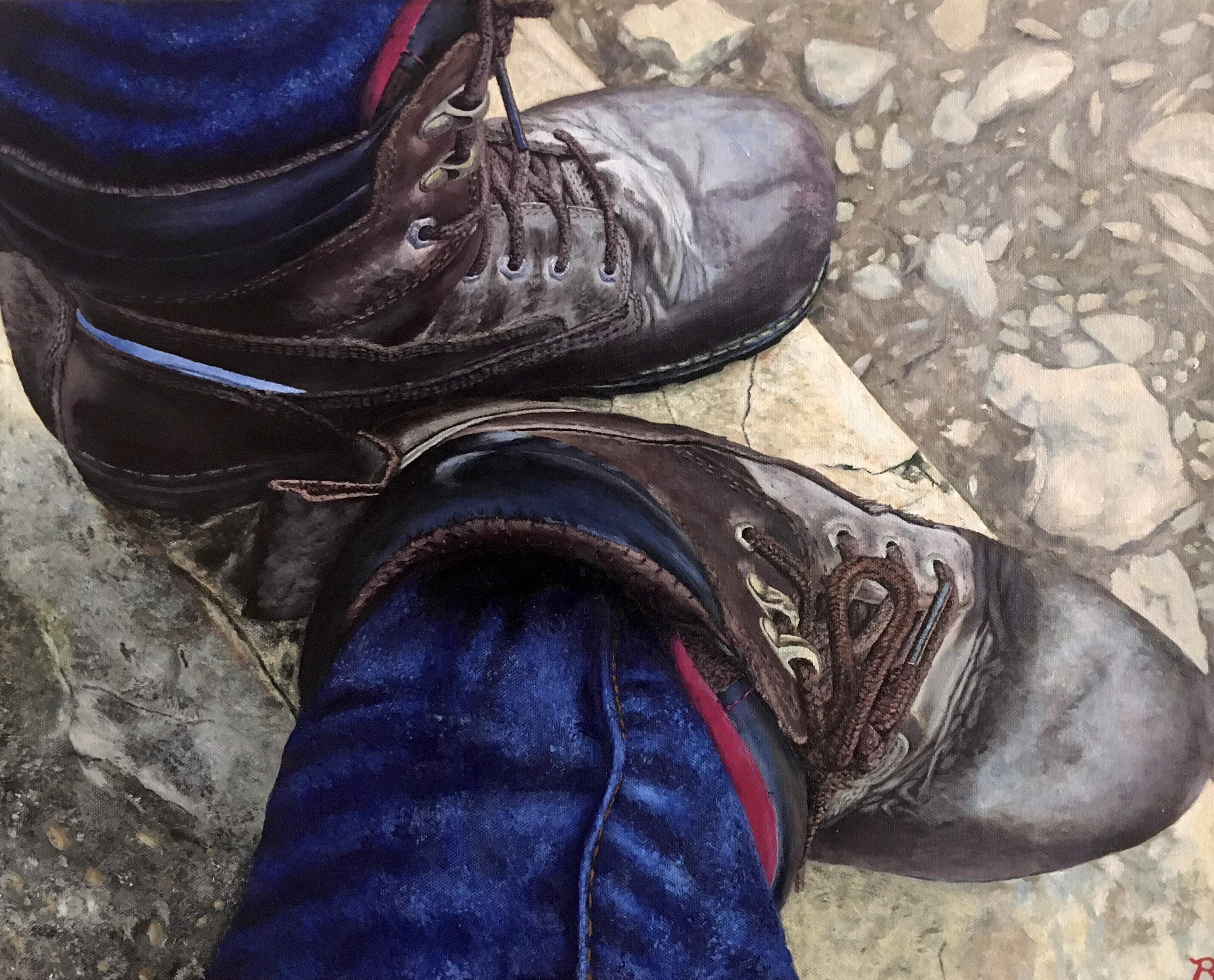 Realistic painting of a person's feet clad in a pair of dark brown leather work boots below blue jeans atop crumbling concrete.