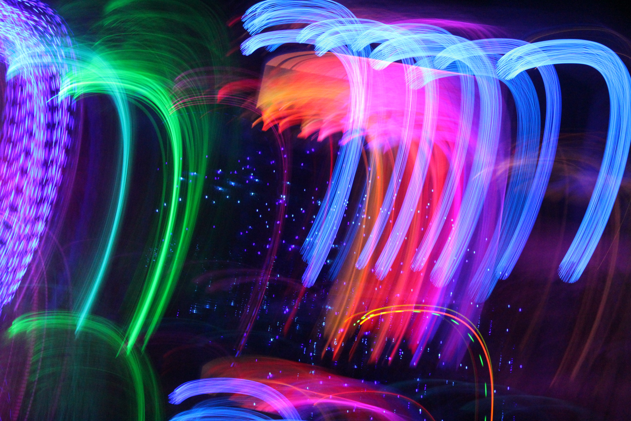 colorful lights smudged in curved line vertically across image